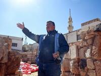 Franco Sciorilli, an Italian expert, speaks to AFP as he supervises workers employed by a pilot project run by the UN cultural agency UNESCO, to restore an ancient church complex, in the small town of Rihab, some 70 kilometres north of the Jordanian capital Amman, on February 9, 2021. In the ruins of the ancient Byzantine church in Jordan, local townspeople and Syrian refugees work side by side on a project that unites preserving cultural heritage and fighting poverty.  Khalil MAZRAAWI / afp