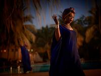 A gold miner presents creations as she takes part in a fashion show as part of the first edition of the International Gold Fair Afrik'Or, in Bamako, on February 12, 2021. The Princess of Burundi Esther Kamatari, selected 34 women among gold mines workers in southern Mali, to walk down the catwalk for a fashion show organised during the International Gold Fair. Gold represents 15% of Mali's exports and more than 20% of its GDP estimated at nearly US$20 billion by the end of 2019. MICHELE CATTANI / AFP