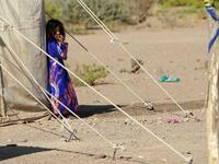 A Yemeni girl stands at a camp for internally displaced people on the outskirts of the northern city of Marib, on February 18, 2021 in the Saudi-backed Yemeni government's last northern bastion. Until early last year, life in Marib city was relatively peaceful despite the Yemen's civil war that erupted in 2014. The United Nations warned last week of a potential humanitarian disaster if the fight for Marib continues, saying it has put "millions of civilians at risk". More than 3.3 million have been displaced