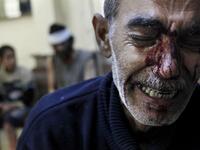  Kamal, the father of an eight-year-old girl who was fatally wounded along with his son Hamed 