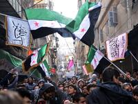 Syrian anti-regime protesters wave pre-Baath Syrian flags