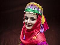 A Syrian Kurdish woman in traditional attire