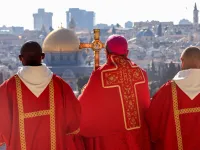 Latin Patriarch of Jerusalem Pierbattista Pizzaballa (C) holds a prayer during a Palm Sunday 