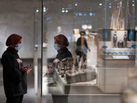 A visitor looks at displayed artifacts at Egypt's new National Museum of Egyptian Civilisation (NMEC) 