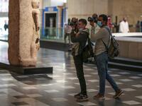 Photojournalists take pictures at Egypt's new National Museum of Egyptian Civilisation 