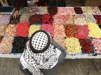 A Palestinian street vendor sells candy and sweets in Hebron's Old City in the Israeli-occupied West Bank 