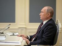 Russian President Vladimir Putin attends a video conference meeting as part of the virtual US-hosted Leaders Summit on Climate, in his residence in Moscow, on April 22, 2020. The US president hopes to rally the world on climate as he unveils more ambitious US commitments at a summit that will bring on board adversaries China and Russia and follows firmer commitments by the European Union and Britain