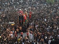 Shiite Muslim devotees take part in a procession to commemorate the death anniversary of Prophet Mohammad's companion and son-in-law Imam Ali in Lahore 