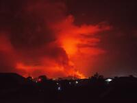 This general view taken on May 22, 2021 in Goma in the East of the Democratic Republic of Congo shows flame spewing from the Nyiragongo volcano. The famous Nyiragongo volcano, near the city of Goma, in the east of the Democratic Republic of the Congo (DRC), suddenly became active on Saturday evening, an AFP correspondent noted. Strong emanations of glowing light coming out of the crater were visible from Goma, while a smell of sulfur was perceptible in the city