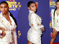 Sierra Capri In a Haleia white and gold blazer skirt set, which she paired with lucite heels, lucite handbag and pendant earrings. 