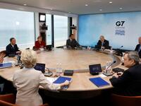 L-R) President of the European Council Charles Michel, President of the European Commission Ursula von der Leyen, Japan's Prime Minister Yoshihide Suga, Germany's Chancellor Angela Merkel, France's President Emmanuel Macron, Britain's Prime Minister Boris Johnson, US President Joe Biden, Canada's Prime Minister Justin Trudeau and Italy's Prime minister Mario Draghi attend a working sesssion at the G7 summit in Carbis Bay