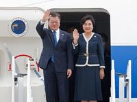 South Korea's President Moon Jae-in and South Korea's first lady Kim Jung-sook arrive at Cornwall Airport Newquay, near Newquay, Cornwall, on June 11, 2021 for the G7 summit. 