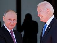 Russian President Vladimir Putin (L) shakes hands with US President Joe Biden prior to the US-Russia summit at the Villa La Grange, in Geneva 