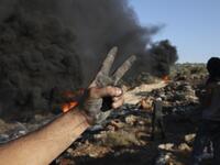 Palestinians burn tires during demonstrations against the expansion of the Jewish settlement outpost of Eviatar, on the lands of Beita village, near the occupied West Bank city of Nablus