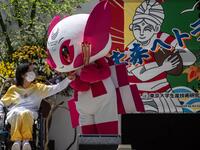 Tokyo 2020 torch relay ambassador Aki Taguchi interacts with the Tokyo 2020 Paralympic mascot Someity during a "flame gathering event" for the Tokyo 2020 Paralympic Torch Relay at the Metropolitan Government Building in Tokyo on August 20, 2021, ahead of the start of the Paralympic Games on August 24. 