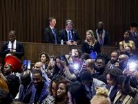 Attendees listen as U.S. Vice President Kamala Harris gives remarks
