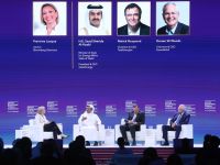 Chairman and CEO of ExxonMobil Darren Woods (R), Chairman and CEO of TotalEnergies Patrick Pouyanné (2nd R) and Qatar's Minister of State for Energy Affairs and President & CEO of Qatar Energy Saad Sherida al-Kaabi, attend a session at the Qatar Economic Forum in Doha on May 15, 2024. (Photo by KARIM JAAFAR / AFP)