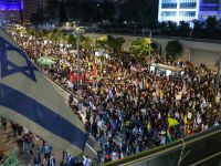 Family members and friends of Israelis held hostage by Palestinian militants in Gaza since October 2023, rally to demand action for their release in front of the Israeli defence ministry in Tel Aviv on March 8, 2025. AFP Hundreds of thousands of ultra-orthodox Jews rally in Jerusalem
