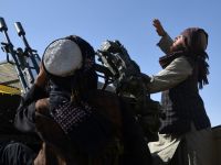 Armed Taliban security personnel watch the sky for Pakistani airstrikes during ongoing clashes between Taliban security personnel and Pakistani border forces in the Spin Boldak district of Kandahar Province on October 15,2025. Photo by SANAULLAH SEIAM / AFP Afghanistan