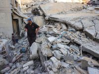 A man and children look at the rubble of a house destroyed in an Israeli strike in Khan Yunis, in the southern Gaza Strip, on October 29, 2025. Photo by BASHAR TALEB / AFP ceasefire