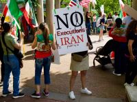 Woman holds a sign