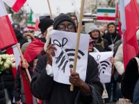 Protestor holds a sign