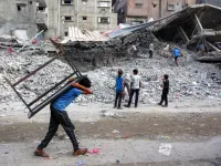 Scavengers amidst destruction in Gaza
