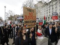 Protesters shout slogans and hold placards during a demonstration on Whitehall opposite Downing Street in central London on April 7, 2018 in support of the Palestianians in the Gaza Strip calling for a stop to the killing organised by the Palestinian Forum in Britain. 

(Tolga AKMEN / AFP)