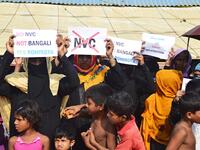 Rohingya refugees women hold placards to members of United nations Security Council team during their visit to Kutupalong refugee camp in Bangladesh's Ukhia's district on 29 April 2018.  Sam Jahan/AFP