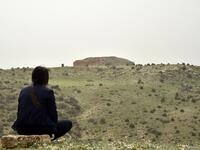 A woman observes one of the Jeddars pyramid tombs, near the city of Tiaret, some 250 kilometres (155 miles) southwest of the Algerian capital, on April 23, 2018.
RYAD KRAMDI / AFP
