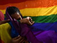 An Indian member and supporters of the lesbian, gay, bisexual, transgender (LGBT) community cries as she celebrates the Supreme Court decision to strike down a colonial-era ban on gay sex, in Chennai on September 6, 2018. 
ARUN SANKAR / AFP