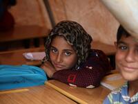 Syrian children who fled with their families from the northern countryside of Hama, are pictured in a classoom at the makeshift school of "Zuhur al-Mustaqbal"  Aaref WATAD / AFP