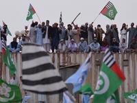 Pakistani supporters of the Ahle Sunnat Wal Jamaat (ASWJ) stand on a container set up to block a street during a protest rally following the Supreme Court's decision to acquit Christian woman Asia Bibi of blasphemy. (AAMIR QURESHI / AFP)
