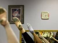 Girls attend a class at a ballet studio in Moscow on November 22, 2018. In a small studio in northern Moscow, parents and grandparents sit in a corridor waiting for children as young as three to finish their ballet class. 
Mladen ANTONOV / AFP
