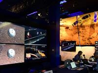People watch the landing of NASA's InSight spacecraft on the planet Mars on television screens at NASA's Jet Propulsion Laboratory (JPL) in Pasadena, California on November 26, 2018.
Frederic J. BROWN / AFP