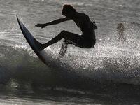 A surfer enjoys the waves at Las Baulas National Marine Park, Playa Grande, Costa Rica on December 10, 2018. David GANNON / AFP