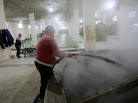 Syrian workers make olive soap in a factory on the outskirts of Aleppo 
LOUAI BESHARA / AFP