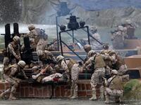 Members fo the UAE Armed forces perform a military drill during the opening of the International Defence Exhibtion and Confrence at the Abu Dhabi National Exhibtion Centre on February 17, 2019. 
AFP