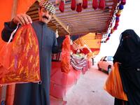 A Kuwaiti vendor holds bags filled with locusts, sold as food, at a market in Kuwait City 
Yasser Al-Zayyat / AFP