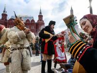 Performers dressed in traditional costumes sing and dance during the Shrovetide spring festival outside the Kremlin in Moscow on March 01, 2019. Mladen ANTONOV / AFP