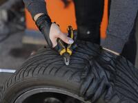 Amina repairs a flat tyre at a car tyre's repair shop in Beirut on March 8, 2019. Amina has been working for 10 years in mechanics, specially in the tyres repair business. She considers it fulfilling as she always dreamt of doing that job.
JOSEPH EID / AFP