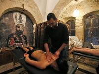 A man get a massage at the first traditional Turkish bath (Hammam) opening in the occupied Palestinian West Bank city of Hebron on March 11, 2019.
HAZEM BADER / AFP