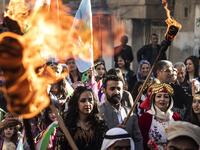 Kurds dressed in traditional outfits carry fire torches as they celebrate Nowruz (Noruz) in the Kurdish-controlled city of Qamishly in northeastern Syria on March 20, 2019.
Delil SOULEIMAN / AFP