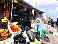 Displaced women buy vegetables and fruits in the souk or market of Al-Hol camp for displaced people in northeastern Syria
GIUSEPPE CACACE / AFP