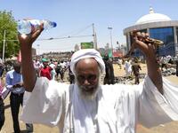 A Sudanese protester takes part in a rally in front of the military headquarters in the capital Khartoum on April 8, 2019, as thousands of protesters urging the military to join calls for leader Omar al-Bashir's resignation.
STRINGER / AFP