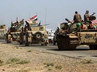 Tanks and vehicles of the combined Iraqi forces and Hashed al-Shaabi (Popular Mobilization) paramilitaries are seen on the advance towards villages between the northern Iraqi cities of Hawija and Kirkuk on October 6, 2017, after retaking Hawija from Islamic State (IS) group fighters a day before.
AHMAD AL-RUBAYE / AFP