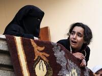 Relatives of Mohamed al-Safadi, a Palestinian militant from Hamas' Ezzedine al-Qassam Brigades who was killed the previous day in an Israeli air strike, mourn during his funeral in Gaza City. Clashes, Palestinian rocket fire and Israeli air strikes killed at least two people and wounded dozens of others on Dec. 8.
(MAHMUD HAMS / AFP)