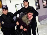 Turkish anti-riot police officers detain a leftist protester during a demonstration against the US and Israel on Dec. 9, 2017 in the Kadikoy district of Istanbul. Turkish President Recep Tayyip Erdogan described Israel as a "state of occupation" which used "terror" against the Palestinians.
(YASIN AKGUL / AFP)