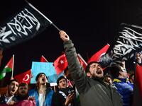 Pro-Palestine protesters chant slogans against US and Israel as they wave Turkish and Palestinian flags during a demonstration in front of Hagia Sophia museum in Istanbul. Thousands marched after prayers in Istanbul to denounce President Trump's decision to recognize Jerusalem as the capital of Israel.
(OZAN KOSE / AFP)