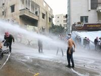 Lebanese security forces use a water hose to disperse protesters during a demonstration outside the US embassy in Awkar, on the outskirts of the Lebanese capital Beirut, on Dec. 10, 2017, to protest against Washington's decision to recognize Jerusalem as the capital of Israel. 
(ANWAR AMRO / AFP)